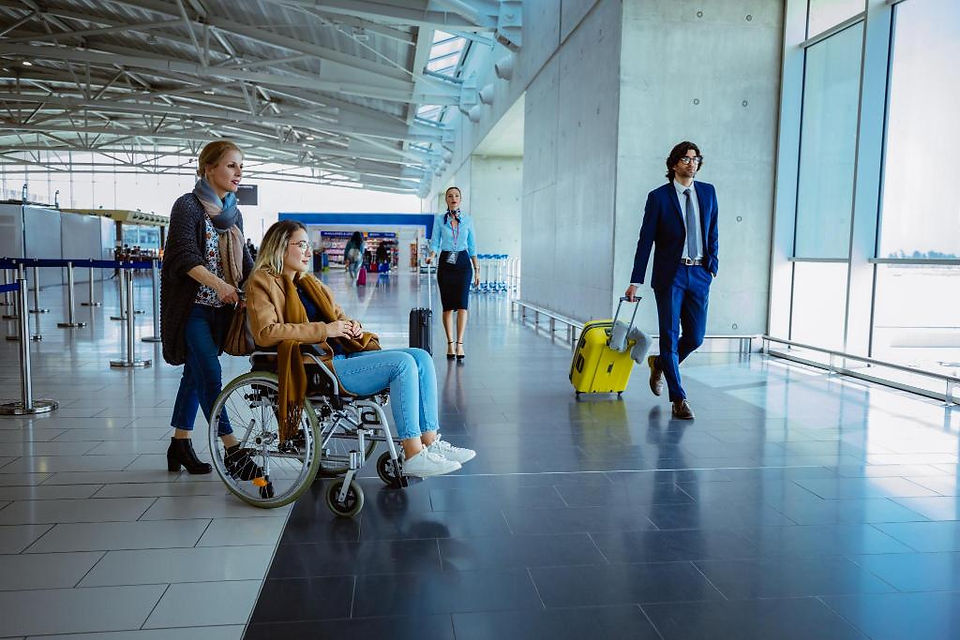a woman with scarf is pushing a manual wheelchair 