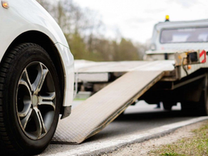 Car towing during heavy rain in Shah Alam