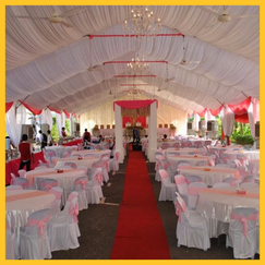 Aesthetic photo corner inside a transparent marquee wedding tent