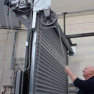 Industrial-grade roller shutter doors at a factory entrance in Malaysia