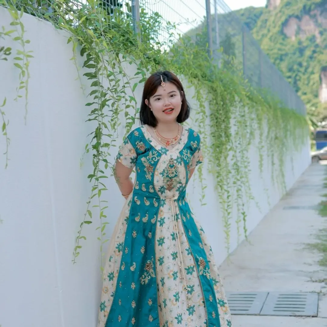Girl in aqua-white sequin saree rental outfit