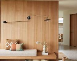 Teak wood wall panels Malaysia with minimalist furniture setup