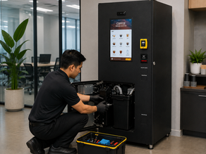Vending machine supplier delivering unit to commercial building.