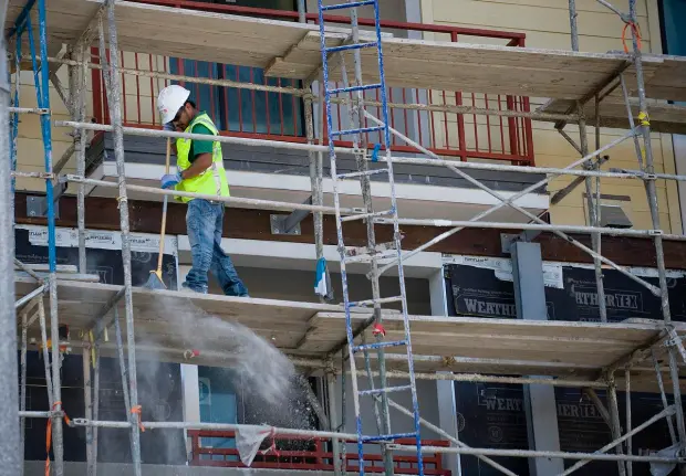 Modular scaffolding is used on construction sites for more flexible work access.
