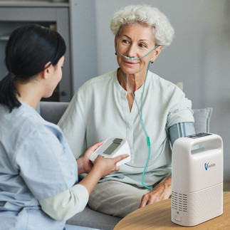 Elderly woman resting while connected to home oxygen machine Malaysia