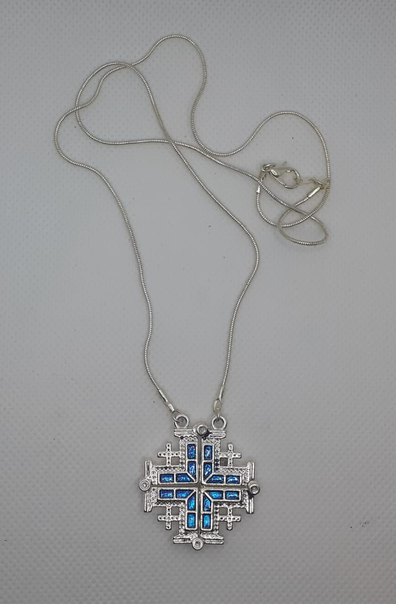 Open cross blue colour metal with a chain