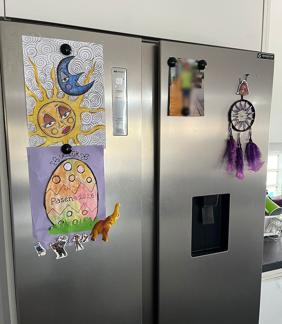 Fridge with kids painting and picture
