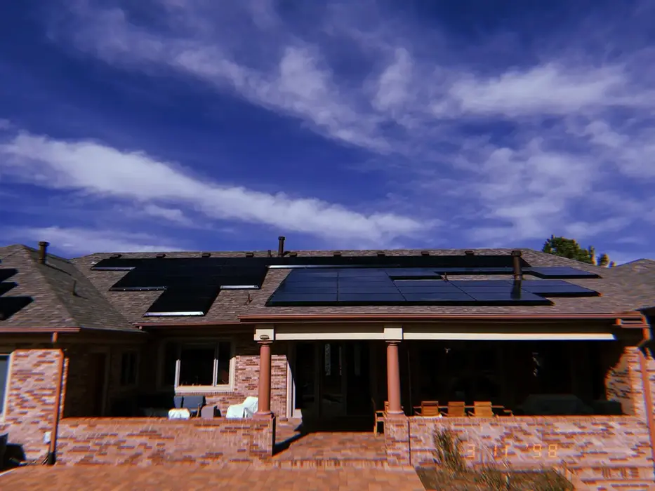 Solar panels on top of a residential roof.