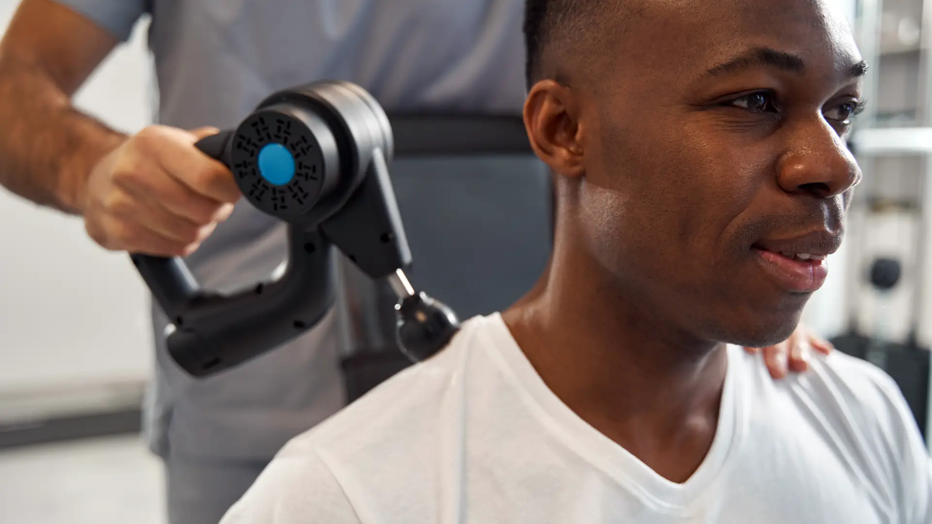 Man having percussion therapy.
