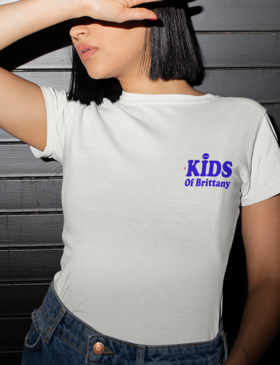 shy-woman-posing-in-a-white-tee-shirt-with-a-print-kids-of-brittany-on-side-at-front