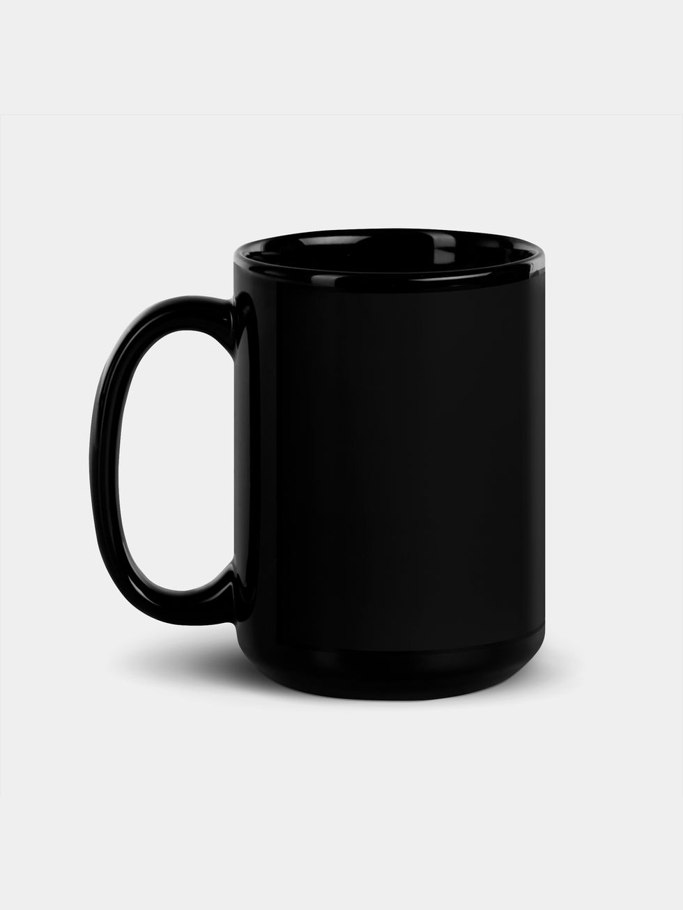 back view of a Breton Mood font with smiley face above printed 15oz black glossy mug