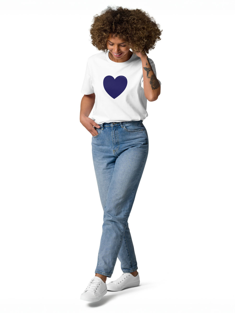smiling-female-in-studio-posing-in-a-white-tee-shirt-printed-with-a-big-heart-on-front