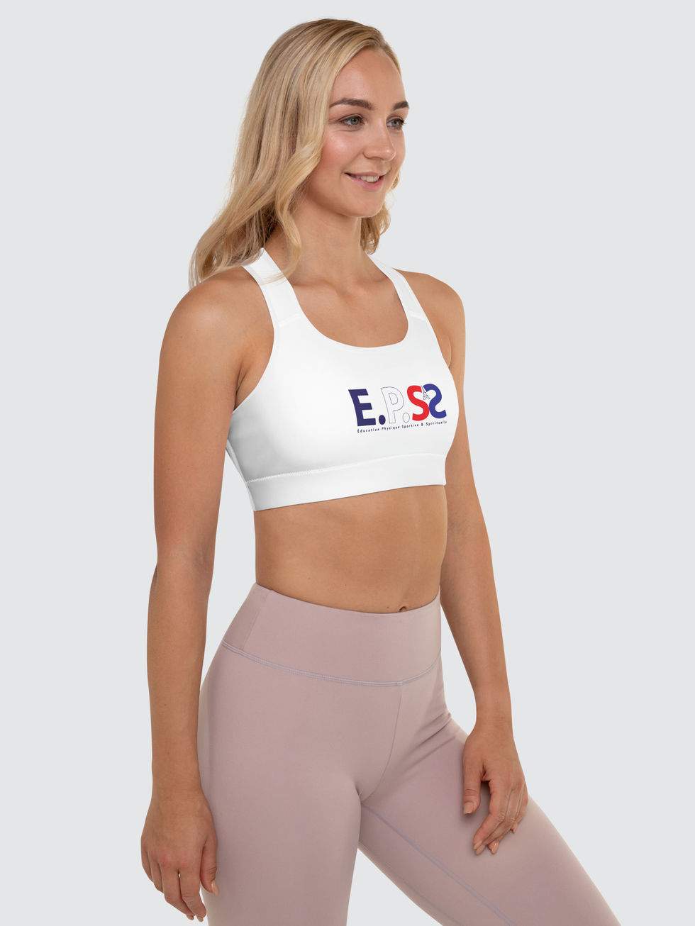 jolie blonde en legging vieux rose et brassiere de sport blanc au logo EPS Spirituel ideal pour pratiquer le yoga