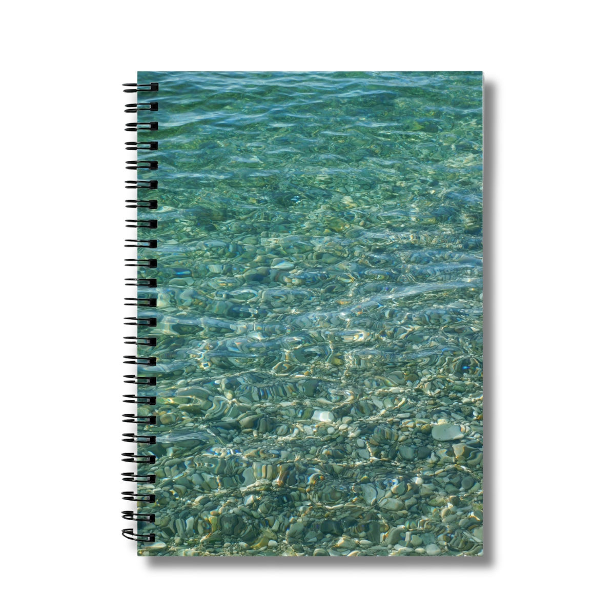 aquamarine photograph on the cover of a notebook