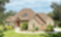 Brown colored home with stone work on the walls