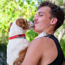 156917447-portrait-of-a-young-man-holding-his-jack-russell-terrier-dog-in-his-arms-cute-do