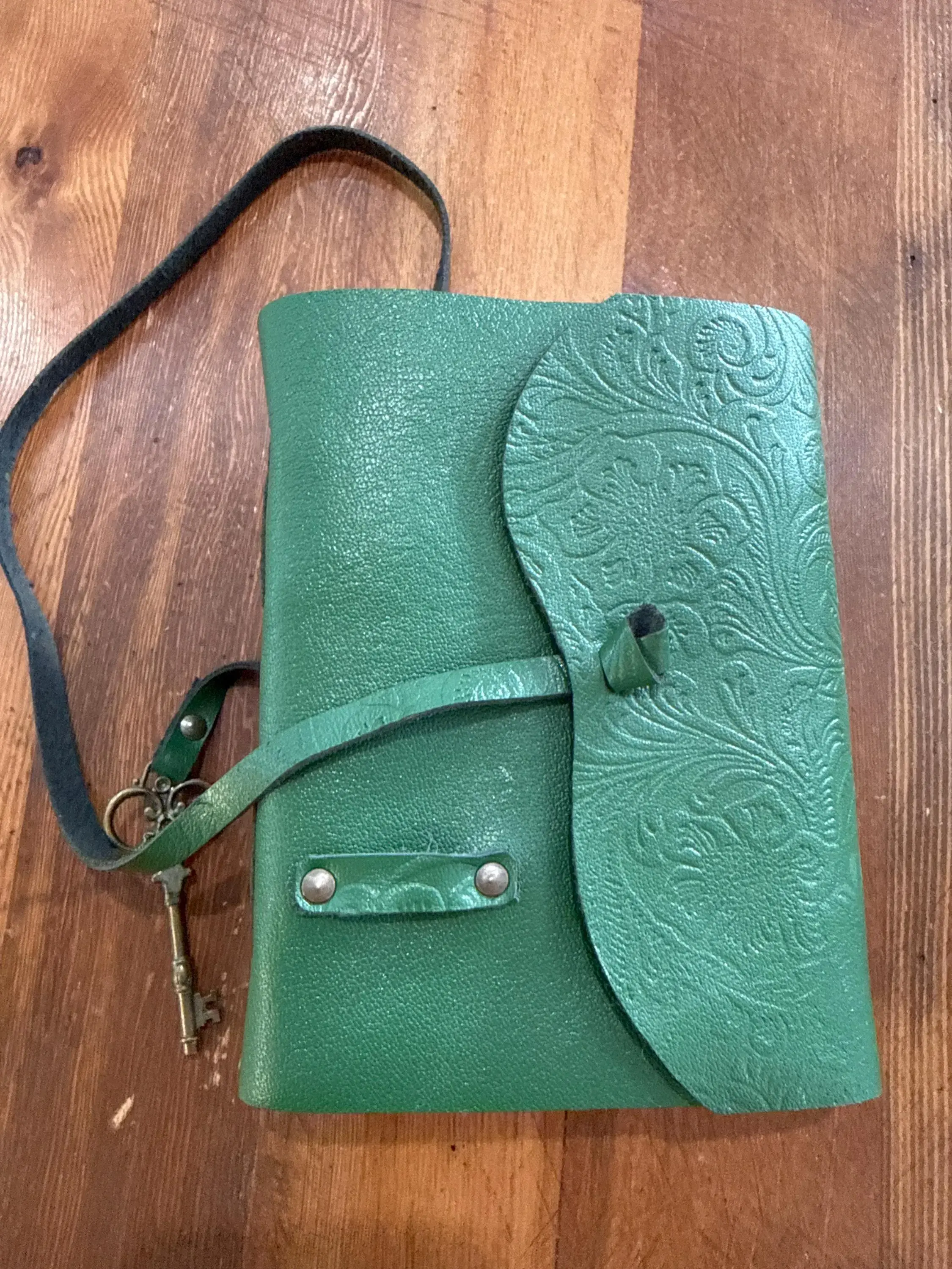 Green leather journal with cotton paper and key