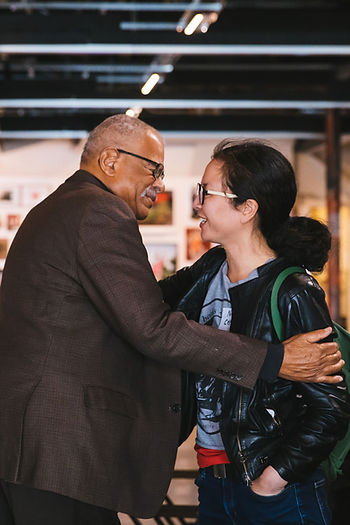 BASE Leadership Committee member Gus Newport congratulates BASE cohort graduate Nancy Chang at the 2019 BASE graduation ceremony.