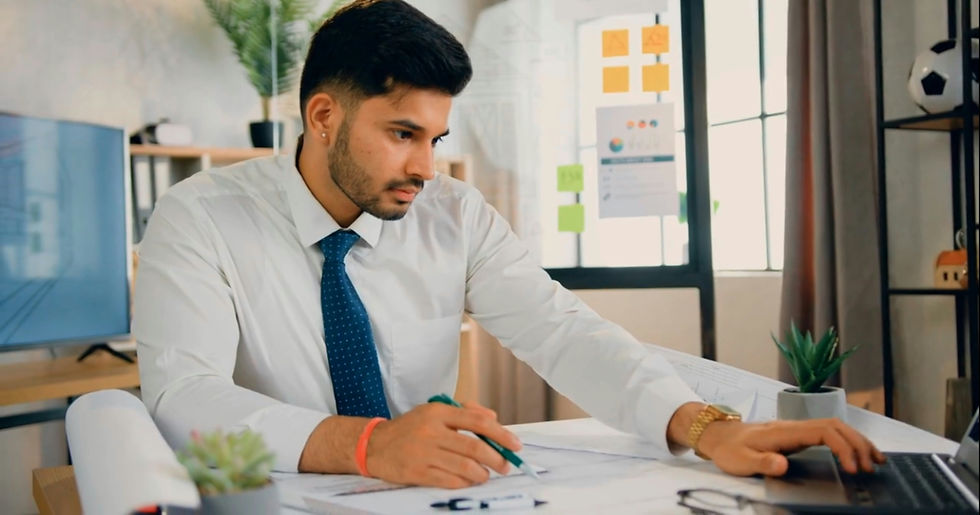 Contract professional reviewing project documents at an office desk, representing contract staffing services in Houston