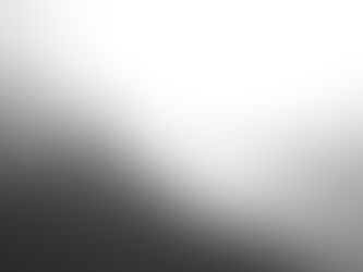 Person walking on a misty beach at sunrise, waves gently lapping the shore. The scene is calm, with warm golden hues from the sun.