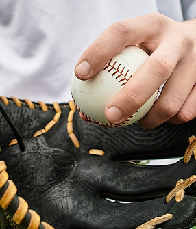 A player prepares to pitch a baseball on a vibrant autumn field, banner.jpg