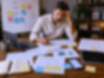 Business owner reviewing scattered marketing activity and strategy needs