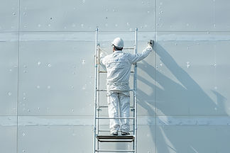 construction-worker-painting-building-wall_edit.jpg