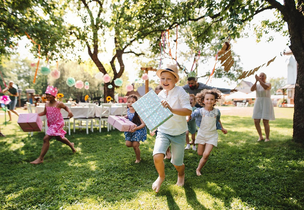 Children are playing outside and having fun at a friend's birthday party.