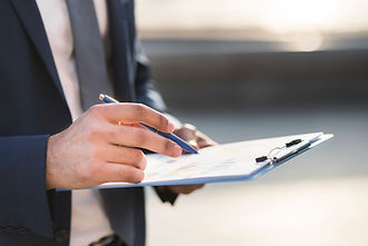 close-up-business-man-checking-clipboard.jpg