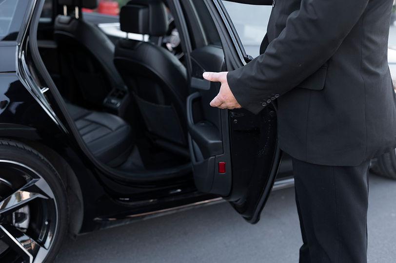 driver-with-opened-car-door (1).jpg