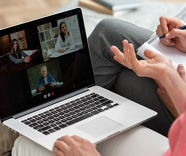 older-couple-home-couch-having-video-call-laptop.jpg
