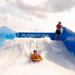 Brandi Swanson riding the FlowRider at Lago Mar Texas.