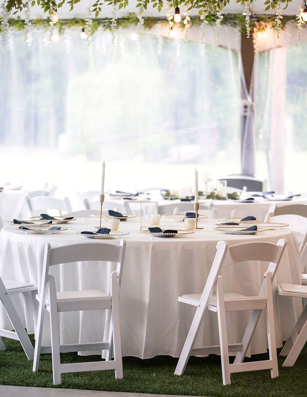 White wedding tables with candles and greenery decor in Texas, the Reserve at Cypress Creek venue.
