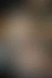 Reception setup with warm lighting and orange accents at Houston wedding.