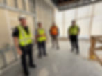 Saco Police Chief Jack Clements, York County Fire Administrator Roger Hooper, York County Sheriff’s Office Chief Deputy Jeremy Forbes and Old Orchard Beach Police Capt. Anthony Ciampi review progress at the new York County Regional Training Center under construction in Alfred on a recent day. The training center is poised to open in the spring of 2026.
