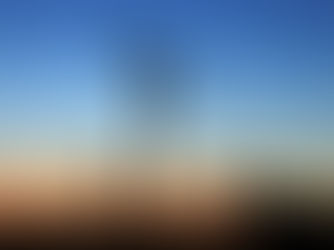 Construction cranes on a development site at dusk