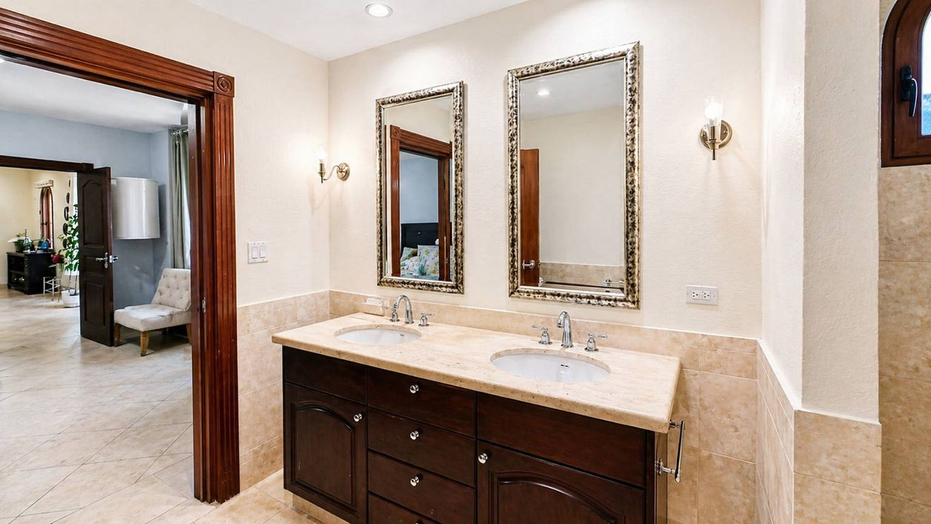 Spacious bedroom suite in Sint Maarten real estate with en suite bathroom and closet