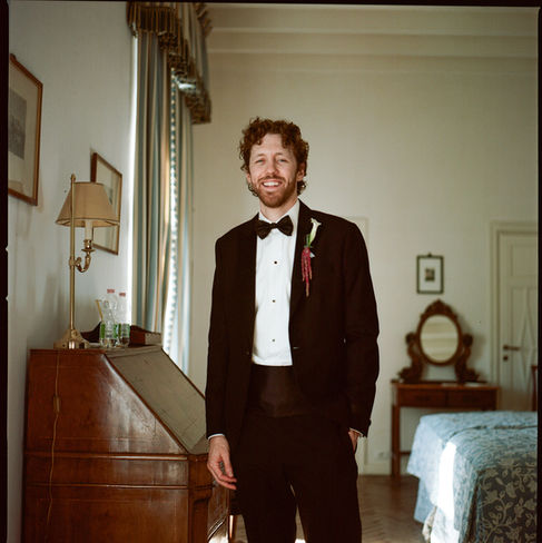 Luxury Destination Wedding at Villa Aurelia. Groom getting ready on film