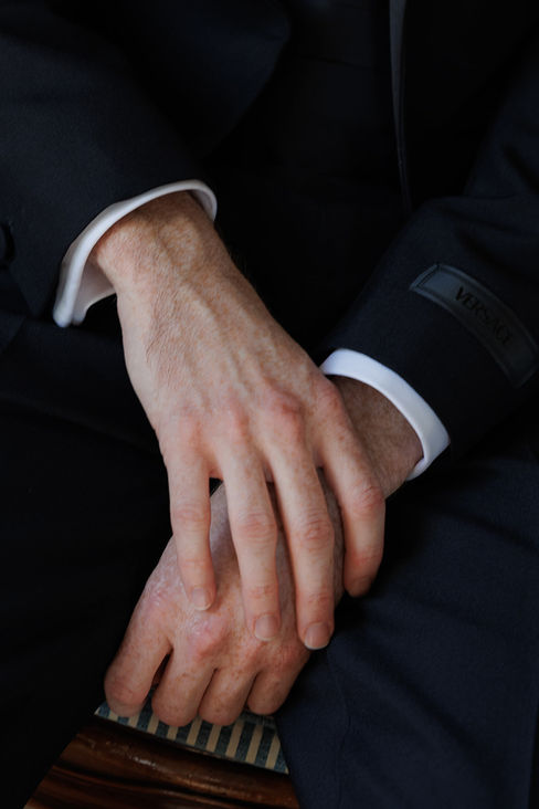 Luxury Destination Wedding at Villa Aurelia. Groom getting ready. Hands details