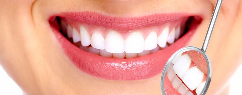 A woman's mouth showing her straigt, white teeth.