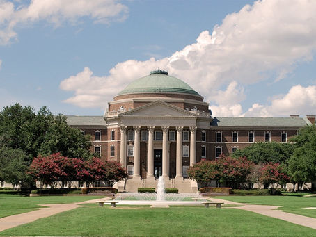 A green in front of a college