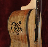 Hand carved upward facing side sound-hole