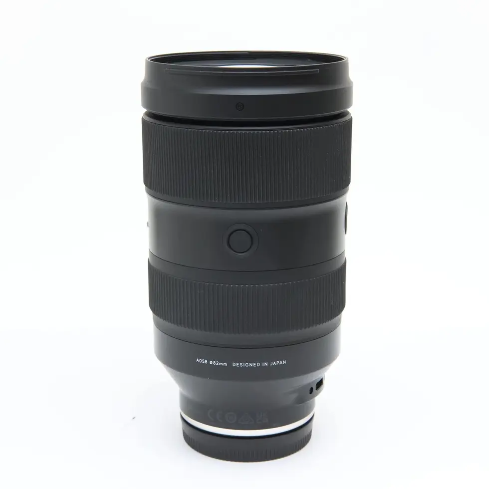 Black Tamron 90mm f/2.8 Di III MACRO VXD (Model F072) lens on white background.
