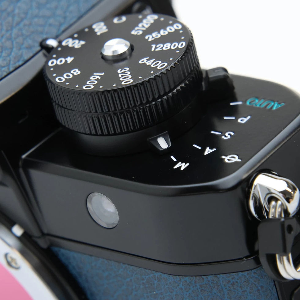 Close-up of Nikon D70s dial and settings for photography, black and silver.