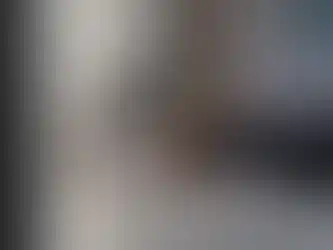 Person entering code on Yale keypad security system to disarm security