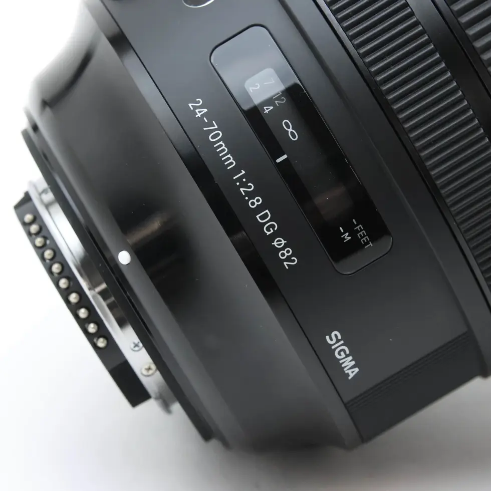 Sigma 24-70mm f/2.8 DG OS HSM Art camera lens with visible text and details