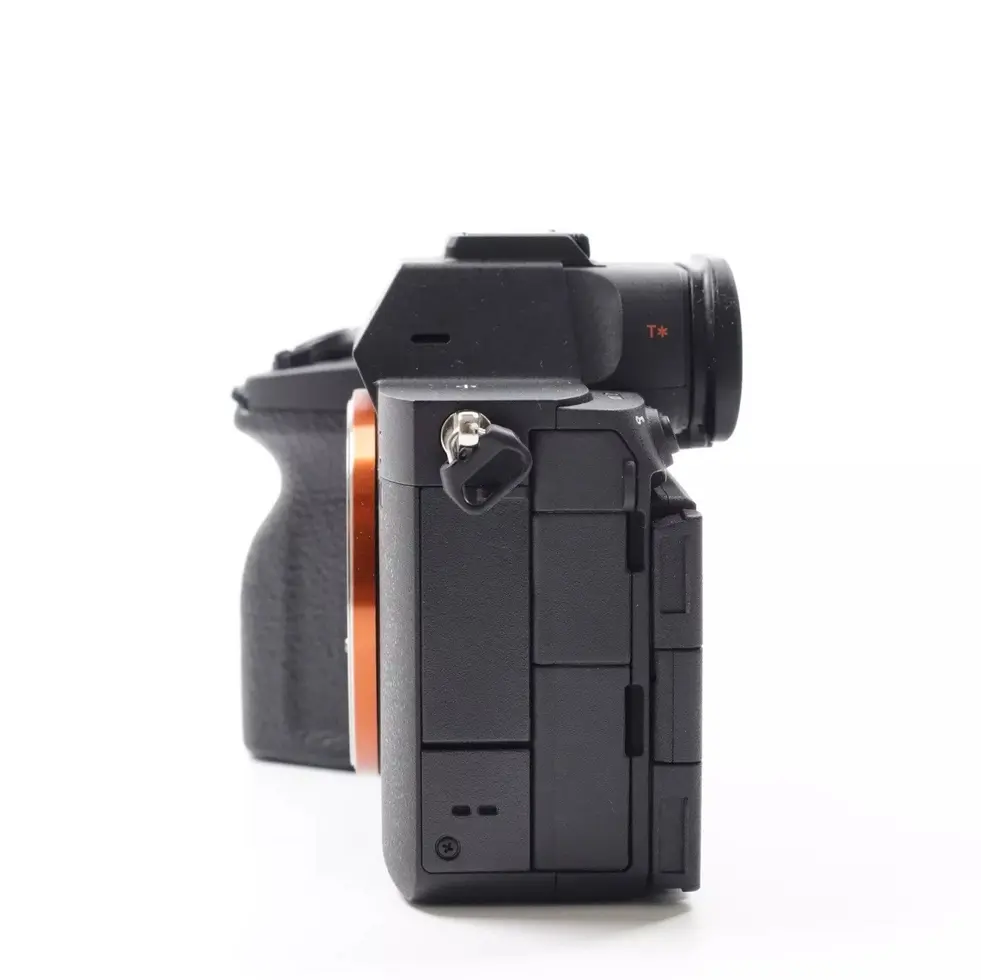 Black digital camera side profile on white background Nikon D5 photography equipment