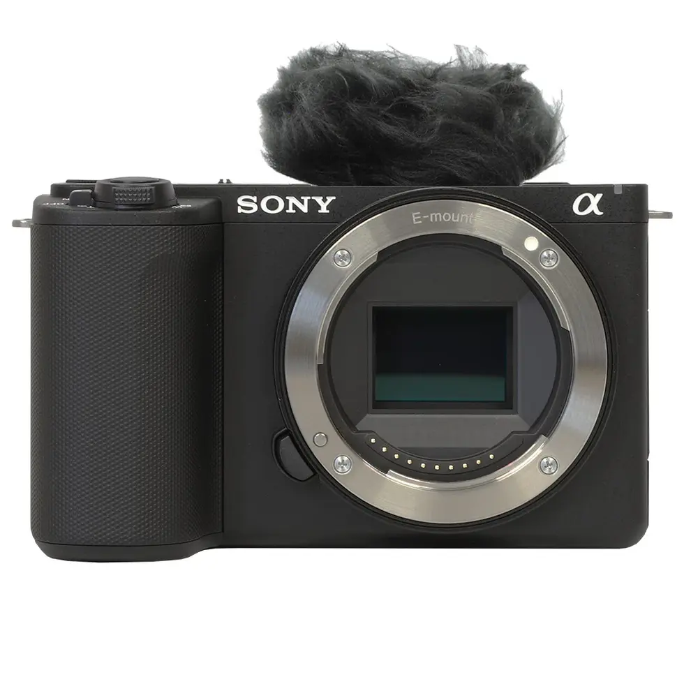 Black Sony Alpha camera with a microphone, ready to record video.