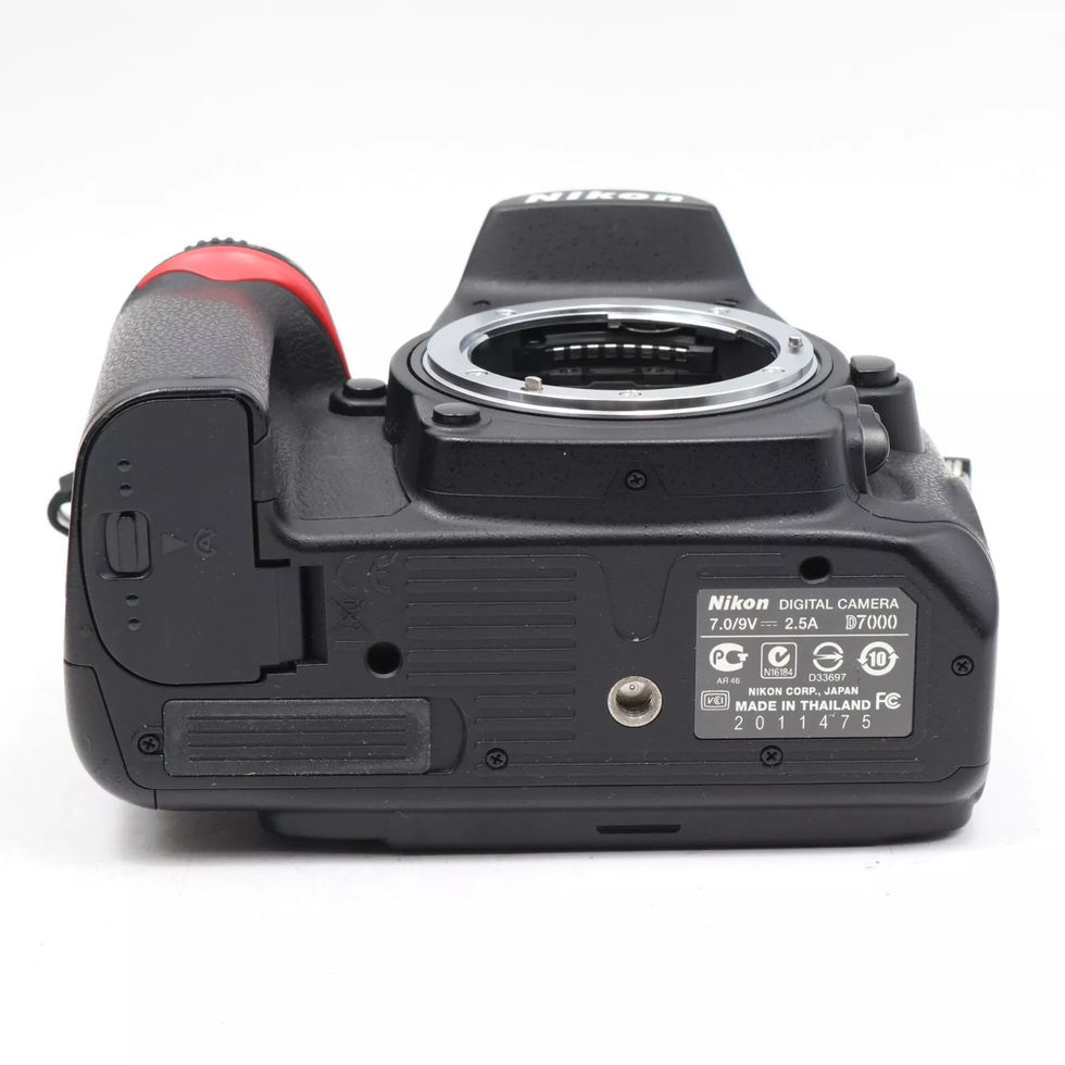 Black Nikon D70 camera with red grip and various ports against white background.
