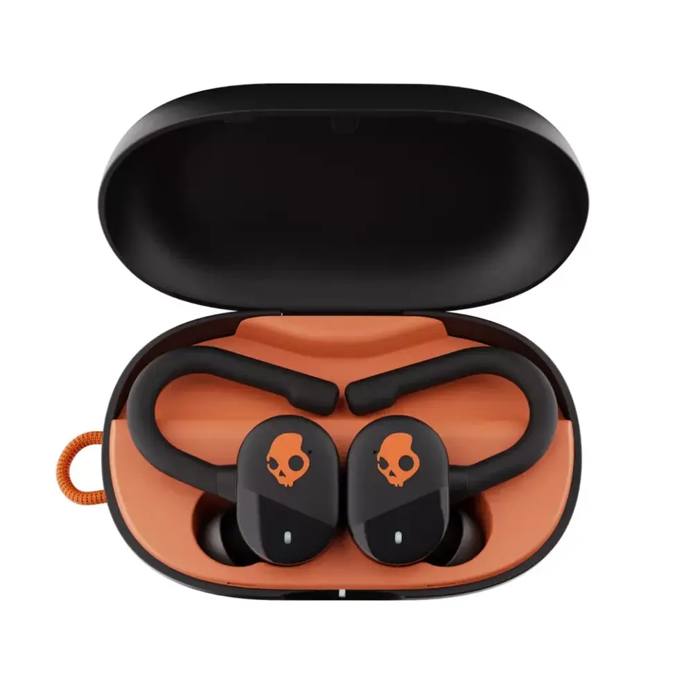 Skullcandy black and orange earbuds in open case; Skullcandy logo visible.